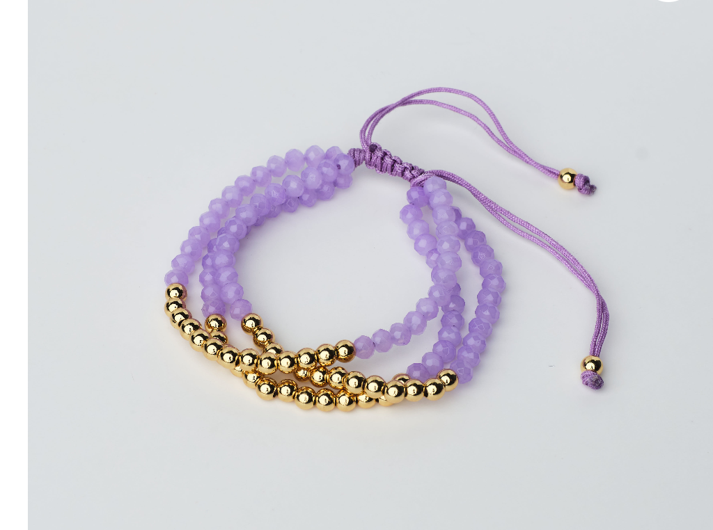 Adjustable bracelet in purple and gold color